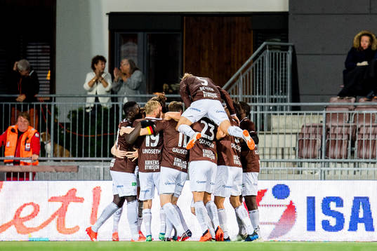 Quint Jansen of Mjøndalen celebrates with teammates after scoring 2-0