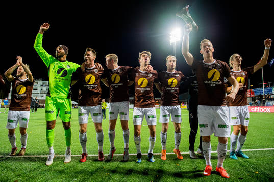 Tonny Brochmann, goalkeeper Sousha Makani, Christian Gauseth, William Sælid Sell, Vetle Dragsnes, Mads Gundersen, Joackim Solberg and Quint Jansen of Mjøndalen celebrate