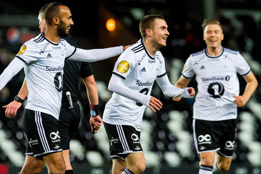 Djordje Denic of Rosenborg celebrates with teammates Issam Jebali and Alexander Søderlund after scoring 1-0