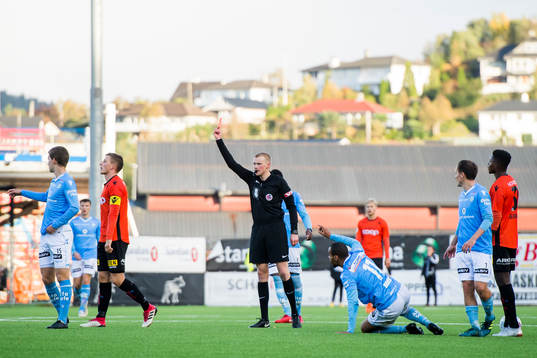 Jonas Hestetun of Åsane is shown a red card by referee Eivind Bodding