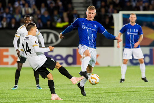 Leandro Trossard of Genk and Joonas Tamm of Sarpsborg 08