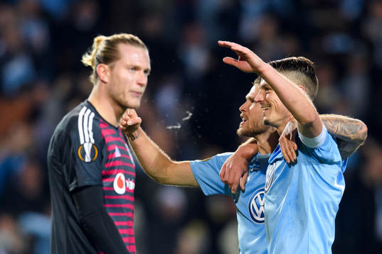 Goalkeeper Loris Karius of Besiktas looks dejected as Arnór Ingvi Traustason and Markus Rosenberg of Malmö FF celebrates after Markus Rosenberg of Malmö FF scores 2-0