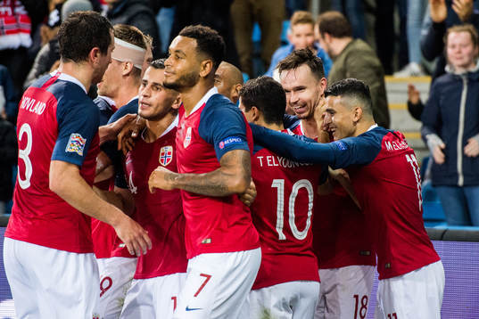 Ole Kristian Selnæs of Norway celebrates with teammates after scoring the 1-0 goal
