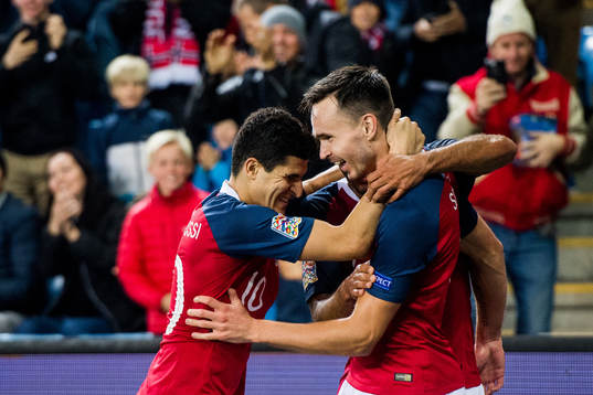 Ole Kristian Selnæs of Norway celebrates with teammates after the 1-0 goal