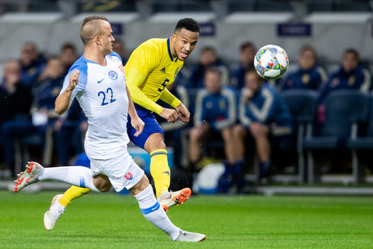Stanislav Lobotka of Slovakiaand Martin Olsson of Sweden