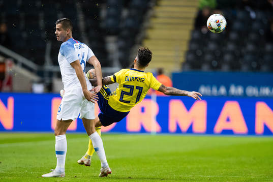 David Hancko of Slovakia and Jimmy Durmaz of Sweden