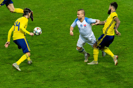 Kristoffer Olsson and Jimmy Durmaz of Sweden against