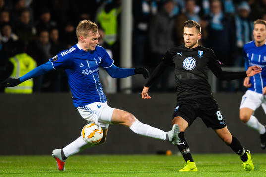 Arnór Ingvi Traustason of Malmö FF and Joonas Tamm of