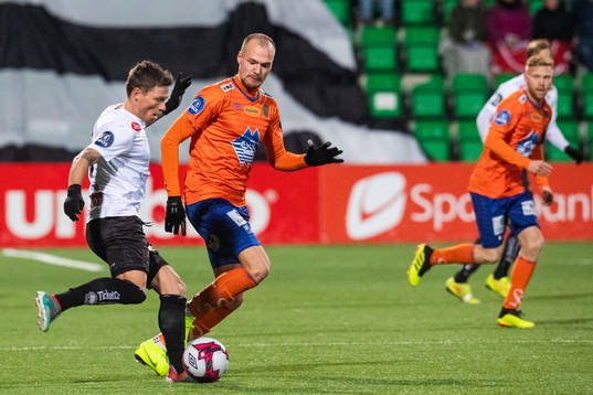Bjørn Helge Riise of Sogndal and Aron Elís Thrándarson of Aalesund competes for the ball