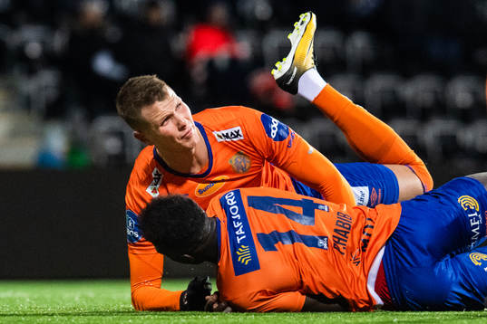 Hólmbert Fridjónsson and Pape Habib Gueye of Aalesund collide