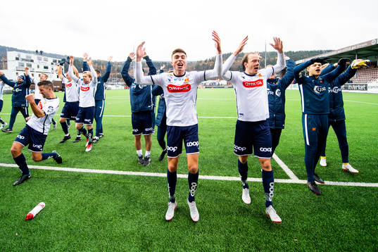 Sondre Flem Bjørshol and Rolf Daniel Vikstøl of Viking celebrate