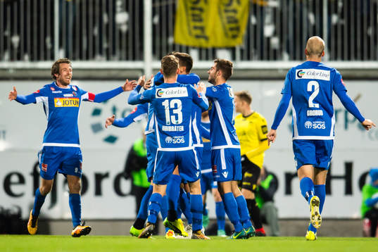 Håvard Storbæk of Sandefjord celebrates with teammates after 1-0