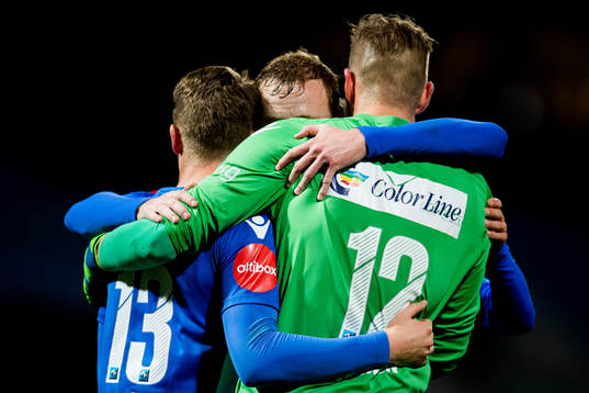 Marius Høibråten, Christer Reppesgård Hansen and goalkeeper Eirik Johansen of Sandefjord celebrate