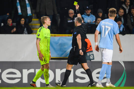 Joonas Tamm of Sarpsborg 08 receives a warning from referee