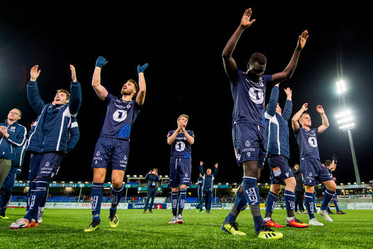 Aliou Coly and the players of Kristiansund celebrate
