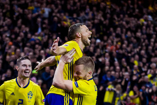 Marcus Berg of Sweden celebrates with his teammate