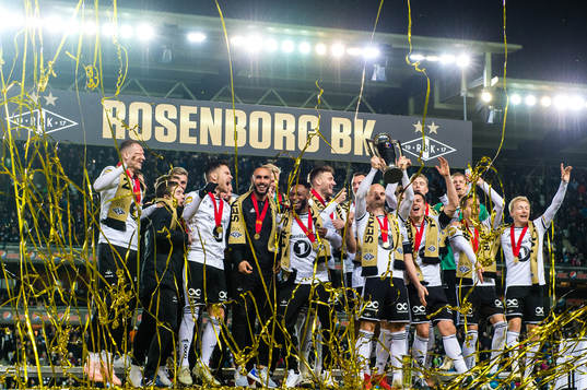 Players of Rosenborg celebrate winning the league
