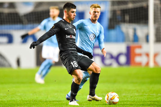 Ruslan Malinovskyi of Genk and Anders Christiansen of Malmö FF
