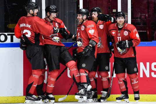 Frederik Storm of Malmö Redhawks (middle) celebrate with