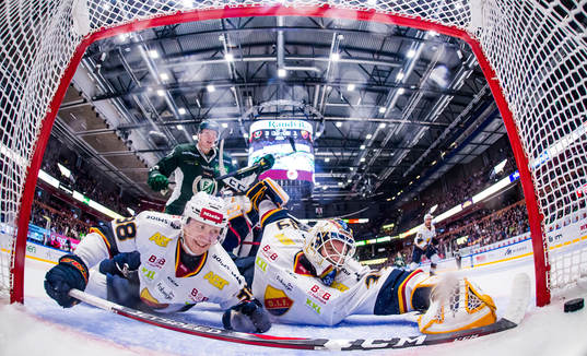 This picture is part of Bildbyrån’s selection of the 100 best sports photos from 2018. Originally published 20181020. Gustav Rydahl of Färjestad, Olle Alsing and goal keeper Adam Reideborn of Djurgården sees Färjestad's Oskar Steen (not pictured) score 4-1