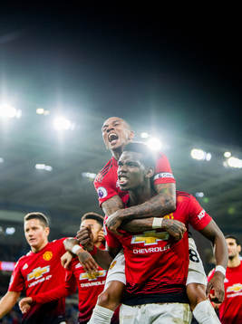 Ashley Young and Paul Pogba of Manchester United celebrate 1-4 during the Premier League match between Cardiff and Manchester United on December 22, 2018 in Cardiff.
