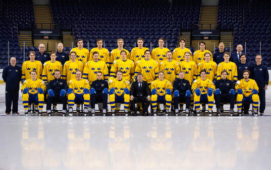 Players and coaching staff of team Sweden pose for an