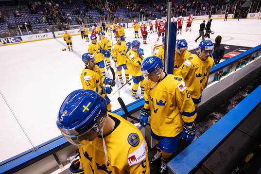 Pontus Holmberg of Sweden and his teammates look dejected
