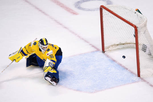 Goaltender Samuel Ersson of Sweden lets in the 0-1 goal