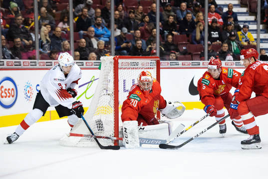 Nicolas Muller of Switzerland challenges goaltender Pyotr