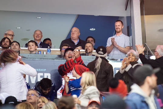 Former Vancouver Canucks player Henrik Sedin is given