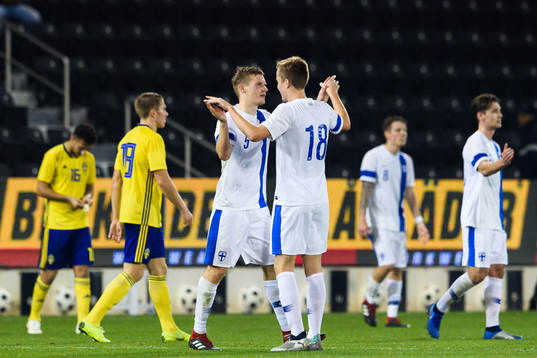 Robert Ivanova and Juhani Ojala of Finland celebrates