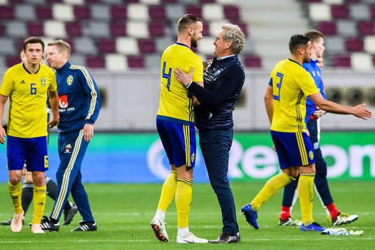 Head coach Erik Hamrén of Iceland  hugs Alexander Milosevic of Sweden 