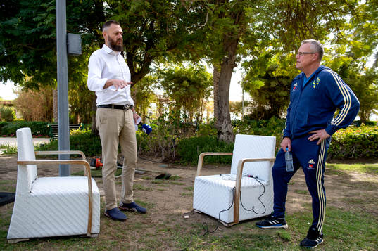 Journalist Olof Lundh talks to Sweden's head coach Janne