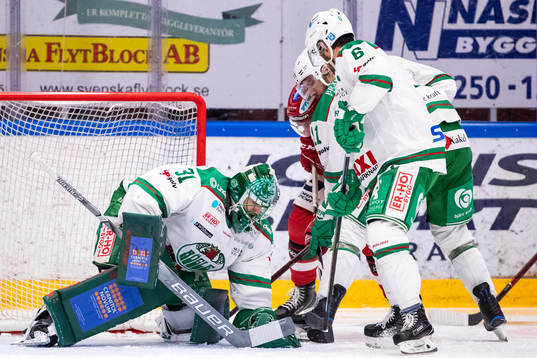 Rögles målvakt Ville Kolppanen och Rögles Craig Schira