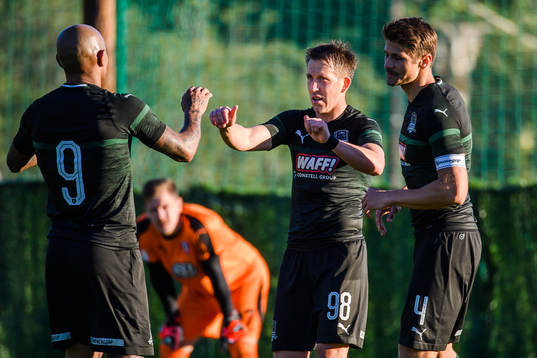 Ferreria Ariclenes Da Silvia and Alexandr Martynovich celebrates the Sergei Petrov of Krasnodar after the 1-0 goal