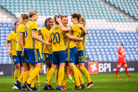 Mimmi Larsson and Mia Carlsson of Sweden  celebrates with teammates after 4-1