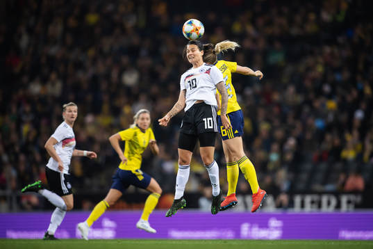 Dzsenifer Marozsan of Germany and Magdalena Eriksson of