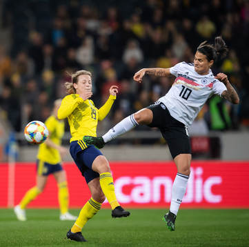 Anna Anvegård of Sweden and Dzsenifer Marozsan of Germany