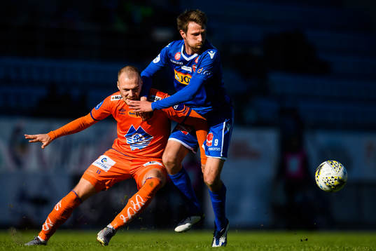 Aron Elís Thrándarson of Aalesund in action with Håvard Storbæk of Sandefjord