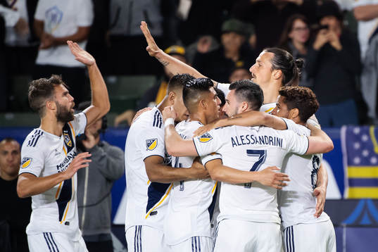Zlatan Ibrahimovic of LA Galaxy celebrates with teammates after scoring 2-0