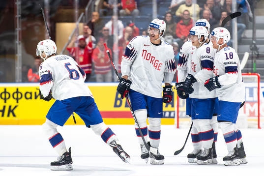 Jonas Holøs of Norway celebrate with Christian Bull ,