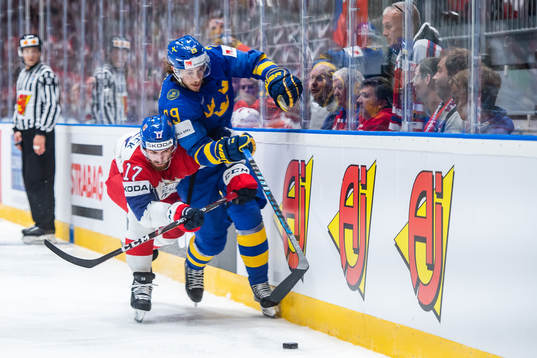 Mario Kempe of Sweden in action with Filip Hronek of Czech