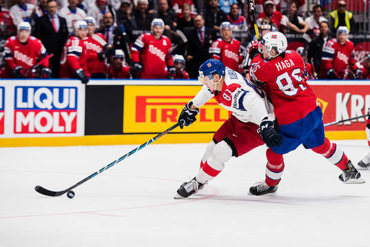 Dominik Kubalik of Czech Republic and Michael Haga of Norway