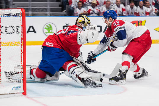 goaltender Henrik Holm of Norway and Jan Kovar of Czech