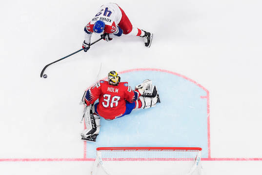 Jan Kovar of Czech Republic against goaltender Henrik Holm