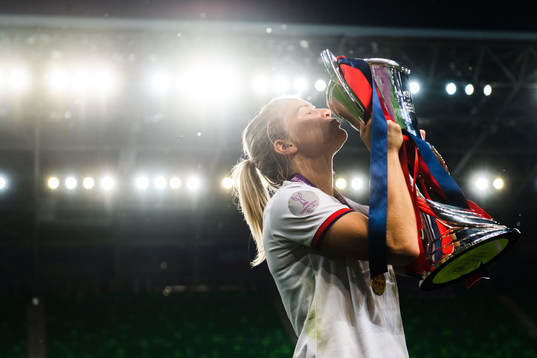 Ada Hegerberg of Lyon poses for a portrait with the trophy