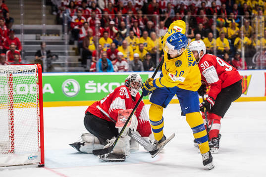 Alexander Wennberg of Sweden and goaltender Reto Berra of