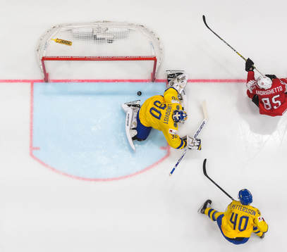 Sven Andrighetto of Switzerland scores 0-1 behind Elias