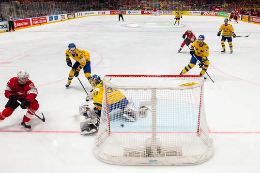 Sven Andrighetto of Switzerland scores 0-1 behind