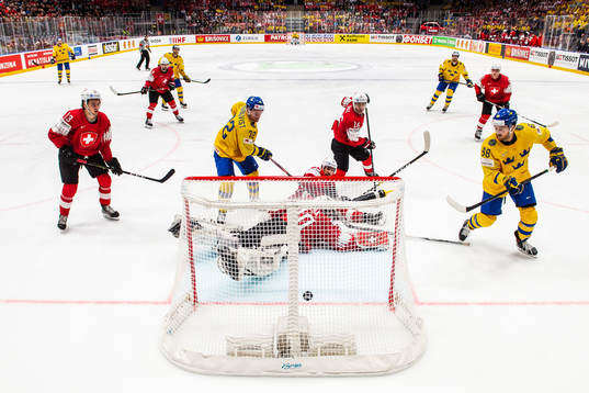 William Nylander of Sweden score 2-1 behind Nico Hischier,